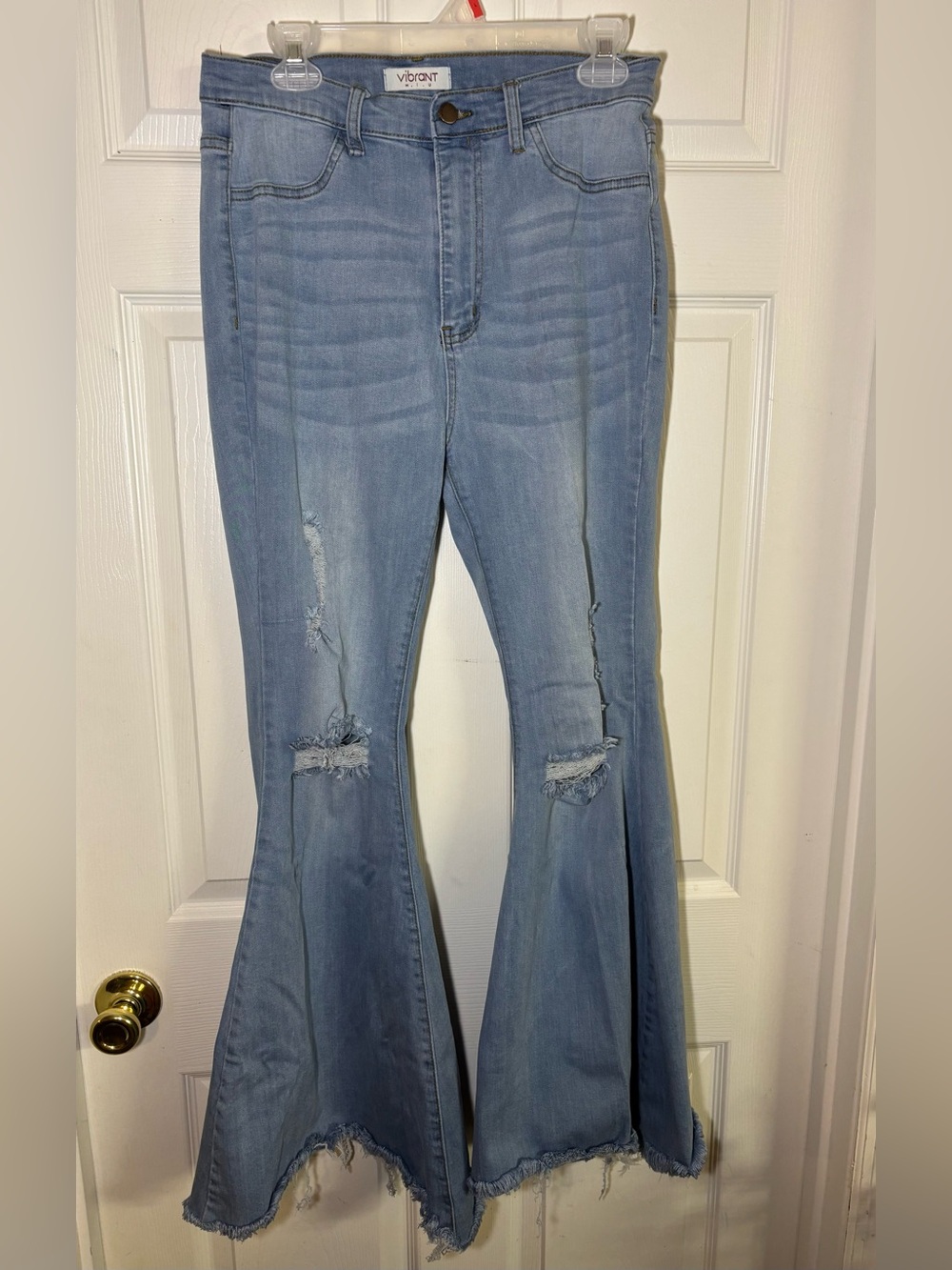 Vibrant light wash distressed flare jeans